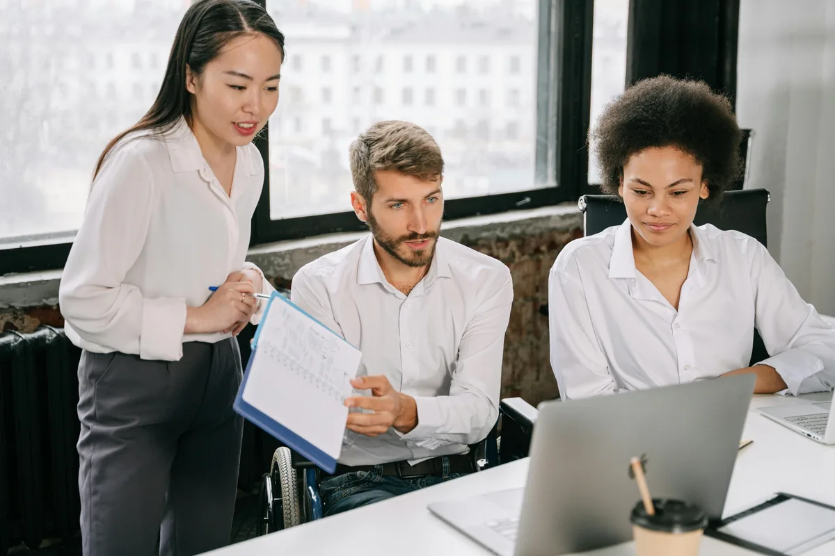 Team reviewing security metrics on a laptop