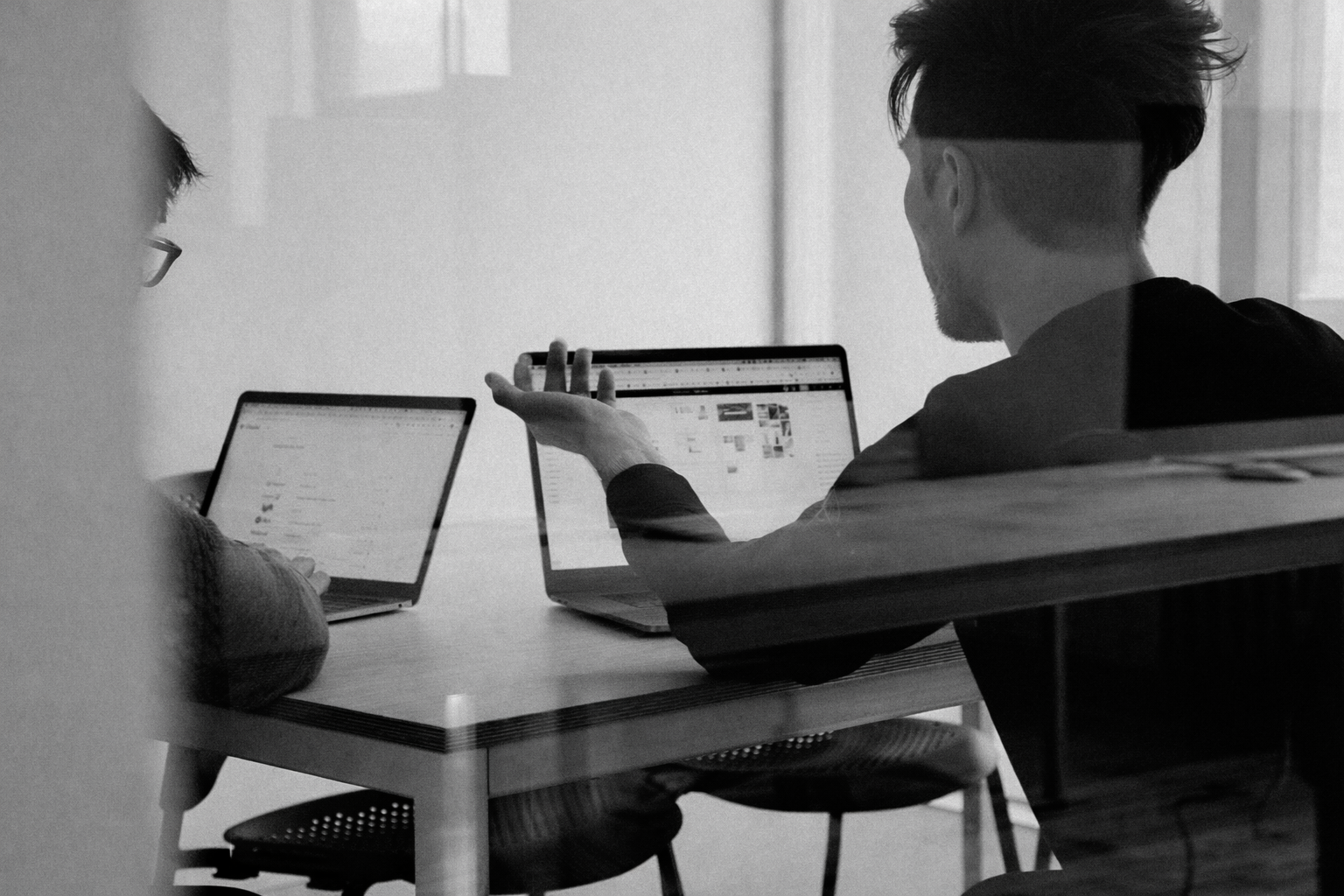Person working on a laptop in a modern workspace